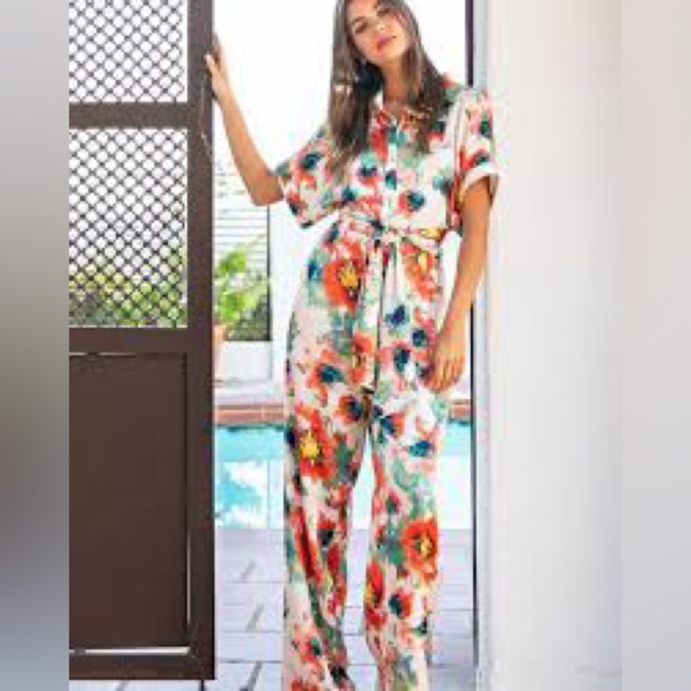 eesome, floral jump suit! Worn once! Size Large!